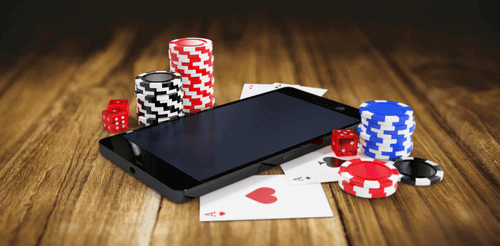 Photo of Dice & Chips on top of Smartphone